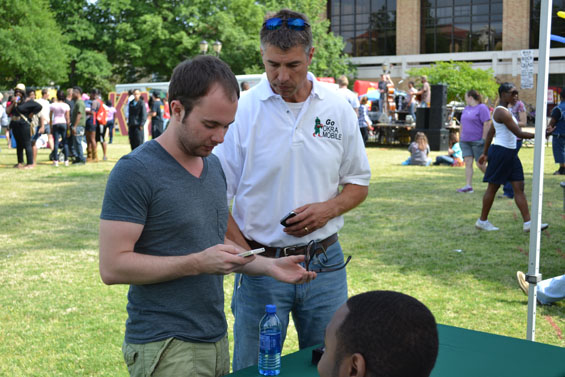 From left, Delta State senior Clayton Gregory, from Cleveland, discusses the new OKRAMobile app with Chris Giger, director of administrative systems for Delta State’s Office of Information Technology during Spring Fest on the Delta State Quadrangle.